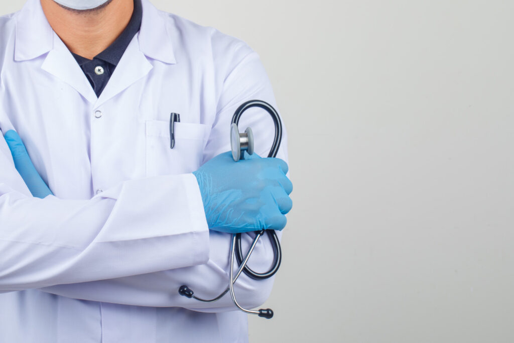 doctor-crossing-arms-while-holding-stethoscope-white-coat